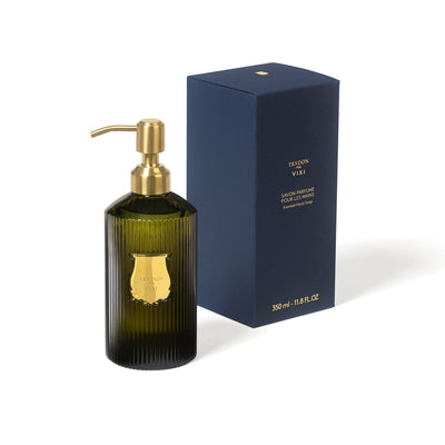 Trudon Vixi liquid hand soap in a signature 350ml fluted green glass bottle with gold pump. A luxury aromatic handwash featuring fresh notes of petitgrain, sage, and sandalwood for a woody, spiritual fragrance.